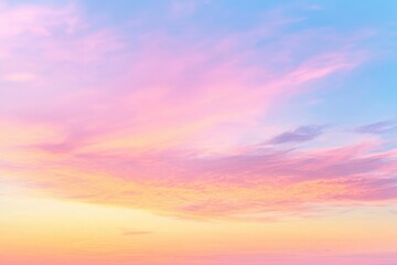 Obraz premium A serene sky at sunset, displaying soft pink and blue hues that create a calming atmosphere.