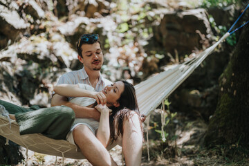 A happy couple shares a lighthearted moment in a hammock in a natural, serene outdoor setting. Emphasizing love, relaxation, and the beauty of nature.