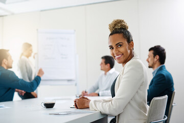 Portrait, smile and business woman in meeting with team for coworking in corporate office. Face, happy and professional sales manager in presentation for budget report, training information and data