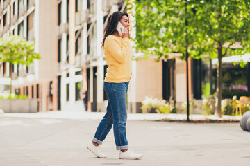 Photo of lovely nice girl wear yellow trendy clothes walk city downtown sunny day outdoors