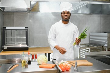 handsome african american chef at restaurant kitchen