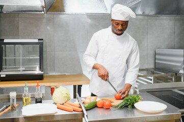 handsome african american chef at restaurant kitchen