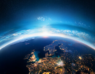 Stunning glow of city lights across Europe and cloud formations viewed from space