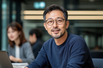 Obraz premium Modern Japanese Entrepreneur Collaborating with Colleagues