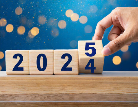 Countdown blocks reveal transition from 2024 to 2025 against a vibrant blue backdrop with bokeh lights