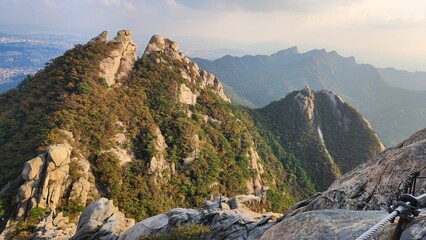 the top of Bukhansan Mountain in Korea in sunny weather in autumn. hiking in korea. mountains Korea Seoul. Maple leaves