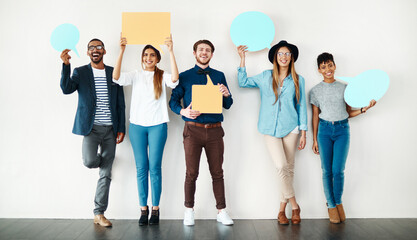 Fototapeta premium Happy, portrait and business people with speech bubble on wall for social media or review on a white background. Young, group or employees with smile, sign or shape for comment, feedback or mockup
