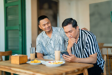 A cozy caf scene featuring two friends sharing a joyful moment