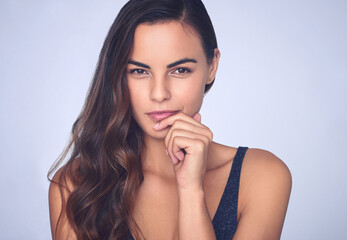 Naklejka premium Portrait, cosmetics and woman with skincare, glow and dermatology on studio background. Face, person and model with natural beauty, grooming routine with shine, texture and treatment with volume