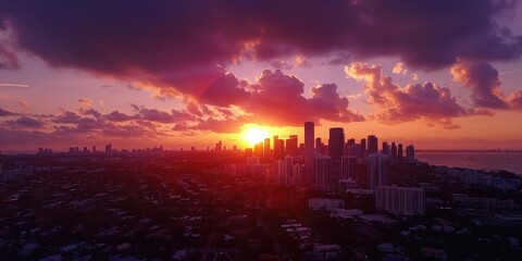 Fototapeta premium Aerial drone view of a city skyline during sunset.