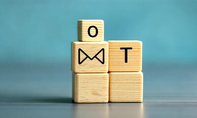 A hand hovering above two wooden blocks, the top block has a black mail symbol, the bottom block is blank. - Powered by Adobe