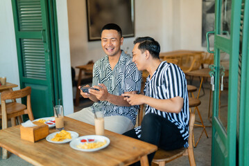 Two close friends enjoy a delightful breakfast and great conversation at a trendy cafe