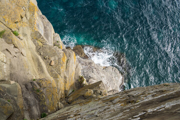 View of the cliffs and the sea from the top of the mountain