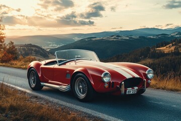 Naklejka premium Classic Red Sports Car on Scenic Mountain Road