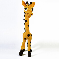 yellow spotted giraffe amigurumi with big eyes background isolated