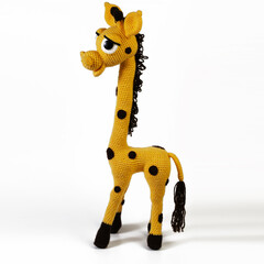 yellow spotted giraffe amigurumi with big eyes background isolated
