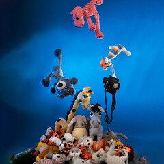 against a blue background resembling the sky, amigurumi dolls seem to fall from top to bottom in one big pile