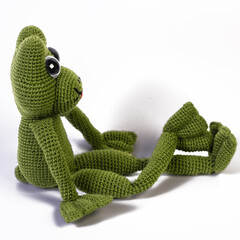 background white isolated frog amigurumi doll sitting
