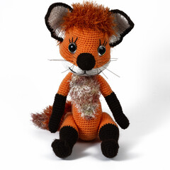 Amigurumi doll fox red background white isolated