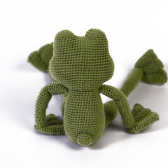 background white isolated frog amigurumi doll sitting