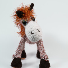 Amigurumi doll horse background white isolated