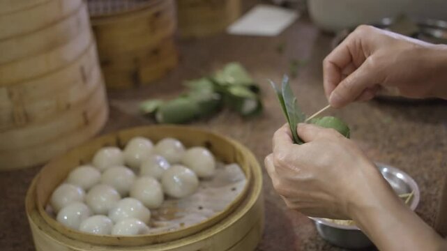 making food with bamboo leaf and rice dumpling