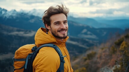 Naklejka premium Handsome man enjoying a scenic mountain hike, taking in the view with a contented smile