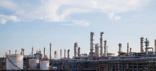 Obraz premium Oil and Gas Industrial zone,The equipment of oil refining,Close-up of industrial pipelines of an oil-refinery plant,Detail of oil pipeline with valves in large oil refinery.