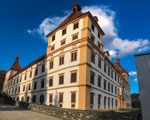 Fototapeta premium Grand and imposing Baroque-style castle Eggenberg in Graz, Styria, Austria, Europe. Facade with intricate details, symmetrical design, and a central dome. Styrian State Museum. Grandeur of the past