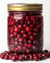 A glass jar of homemade cranberry relish isolated on white background. 