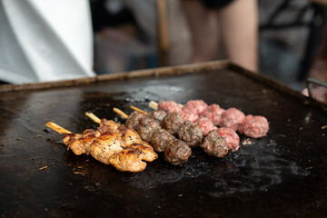 Grilled meat skewers in a herb marinade on a grill pan, top view, Fresh turkey meat skewers, Kabab, beef, street food