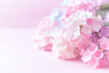 A beautiful arrangement of soft pink and white blossoms rests gently against a light pink backdrop, inviting a sense of calm and elegance to any decorative setting