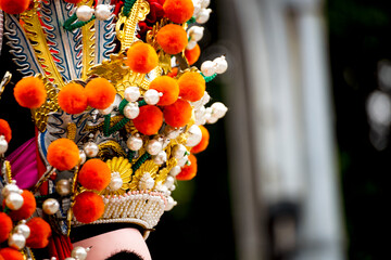 the exquisite details of a deity's headdress