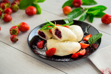 cooked sweet homemade steamed dumplings with strawberries