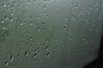Aesthetic rain drops on the window of the car 