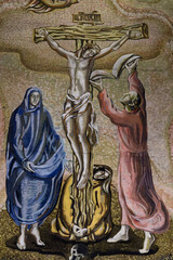 2024-08-03, Paris, FRANCE. Fresco of Jesus Christ crucified on the cross represented with Marie and Saint John. .