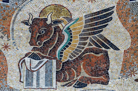2024-08-03, Paris, FRANCE. Mosaic of The tetramorph, symbolizing the four evangelists with their attributes: the bull for Luke..