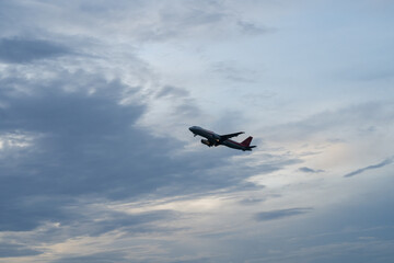  airplane flying on white cloudy  sky
