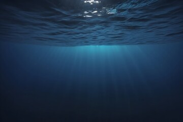 Underwater perspective of the ocean, capturing the play of light and shadows in the deep blue seascape.