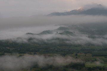 A landscape view of nature of green mountain at sunrise morning