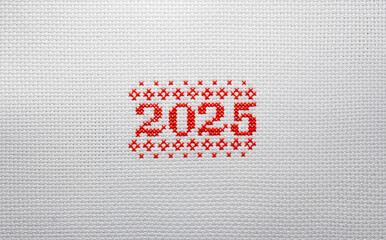 2025 embroidered with red threads on white fabric. 