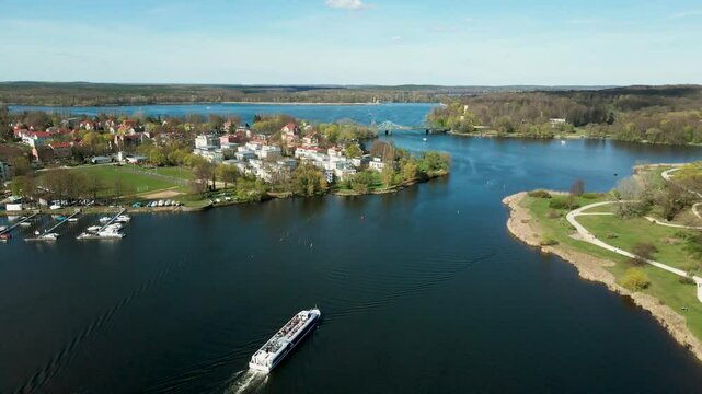 Aerial drone shot of Glienicker Bridge with boats on Glienicker Lake, Potsdam - Germany