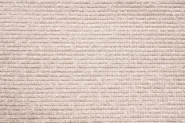 Knitted warm beige flat surface, warm beige background