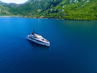 Luxury yacht in the bay at anchor. The recipe for a luxurious successful life