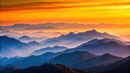 Fototapeta premium Mountain ranges fading into distance under gradient sunset sky