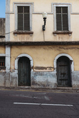Old weathered timeworn shabby house front in Funchal, Madeira