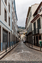 Narrow street with buildings in Funchal city