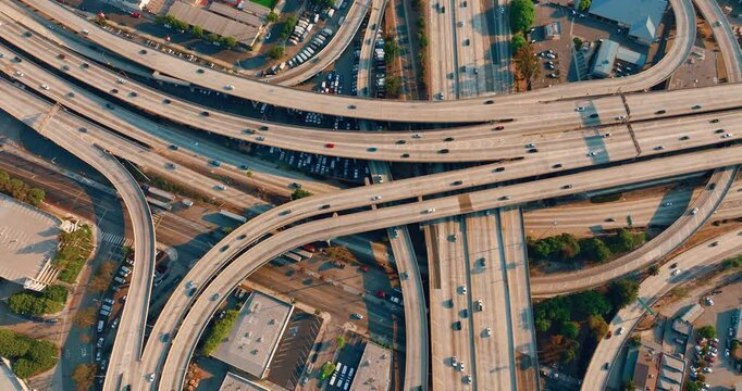Aerial view from above of the interstate intersection. A multi-level road with bridges and interchanges in Los Angeles.