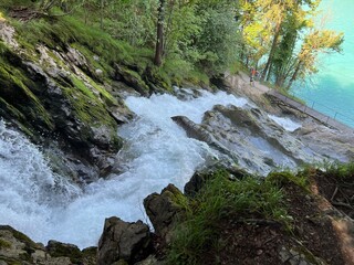 Obraz premium Giessbach Falls in the eponymous nature park and over Lake Brienz - Giessbachfälle (Giessbachfaelle) im gleichnamigen Naturpark und über dem Brienzersee-Canton of Bern, Switzerland (Schweiz)