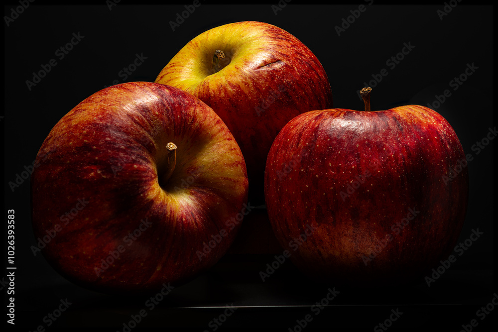 Wall mural red apples on black background